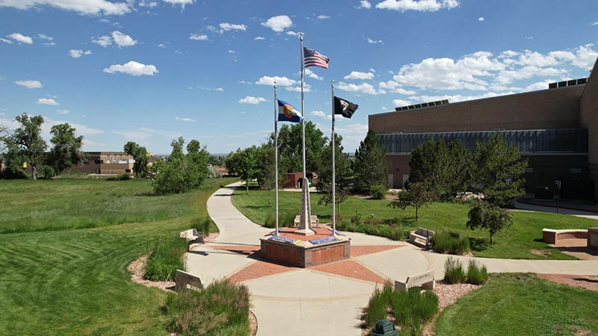 Five sided obelisk memorial in front of the Veterans Memorial Aquatic Center.
