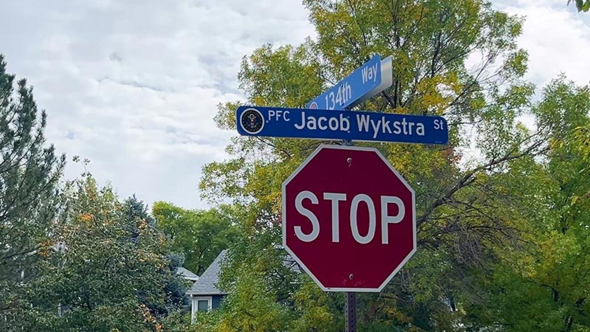 Honorary street name sign PFC Jacob Wykstra (High Street renamed to PFC Jacob Wykstra Street).