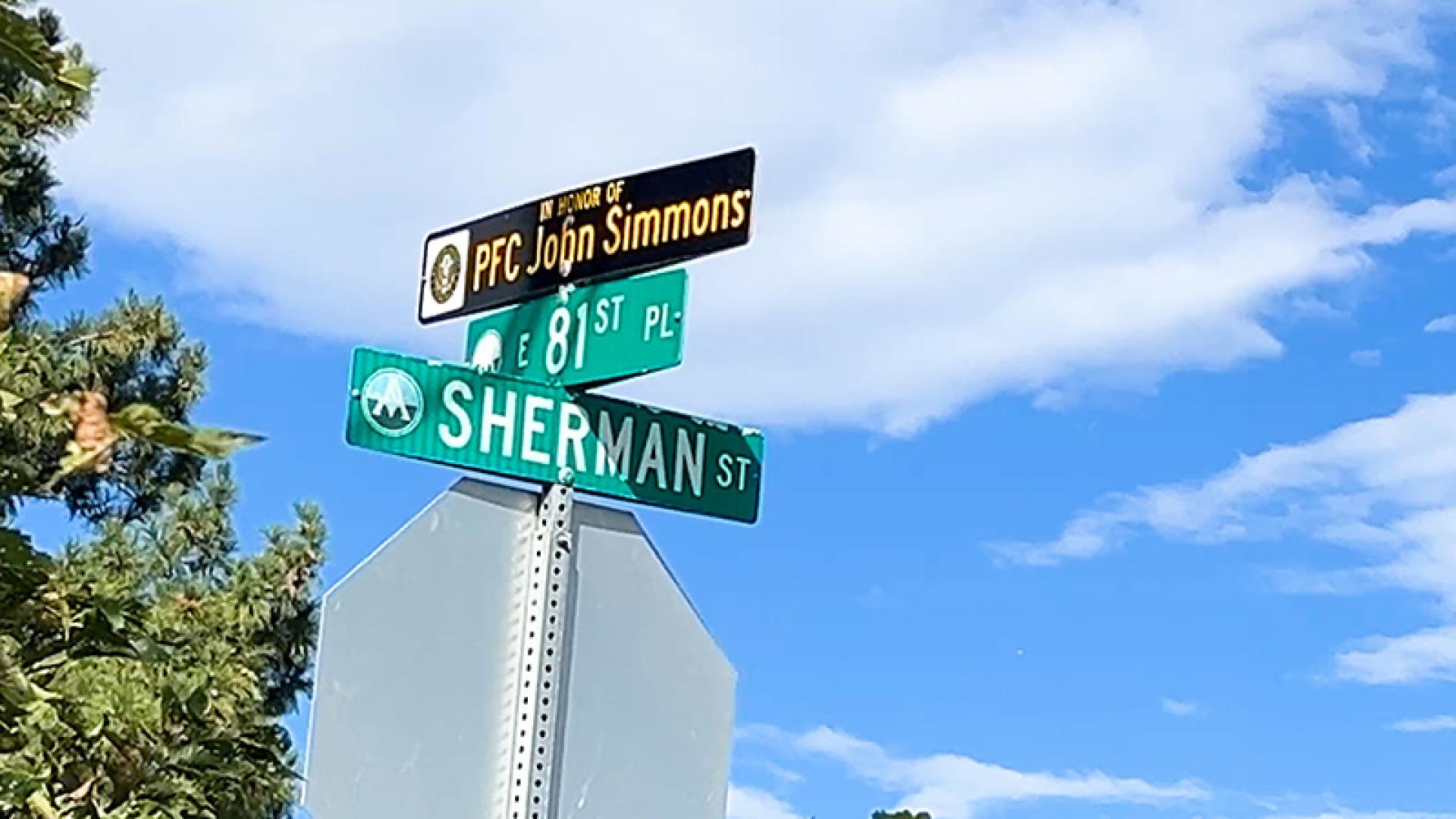 Honorary street name sign Private First Class John Wayne Simmons (81st Place).