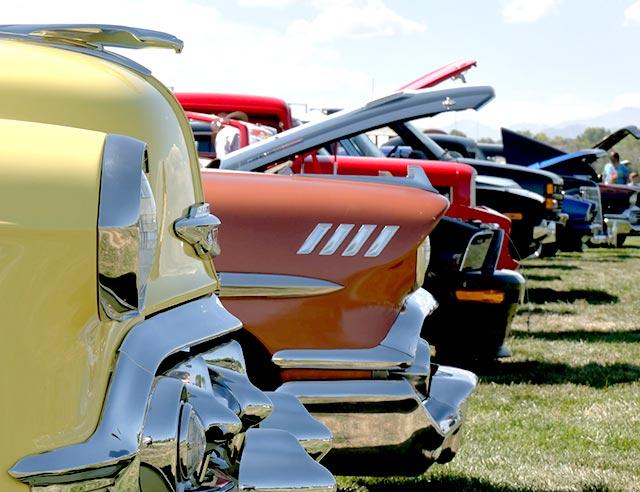 Different styles of cars lined up at the Fuel & Fury Car Show.