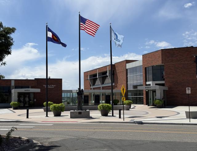 Front of police department with flags flying